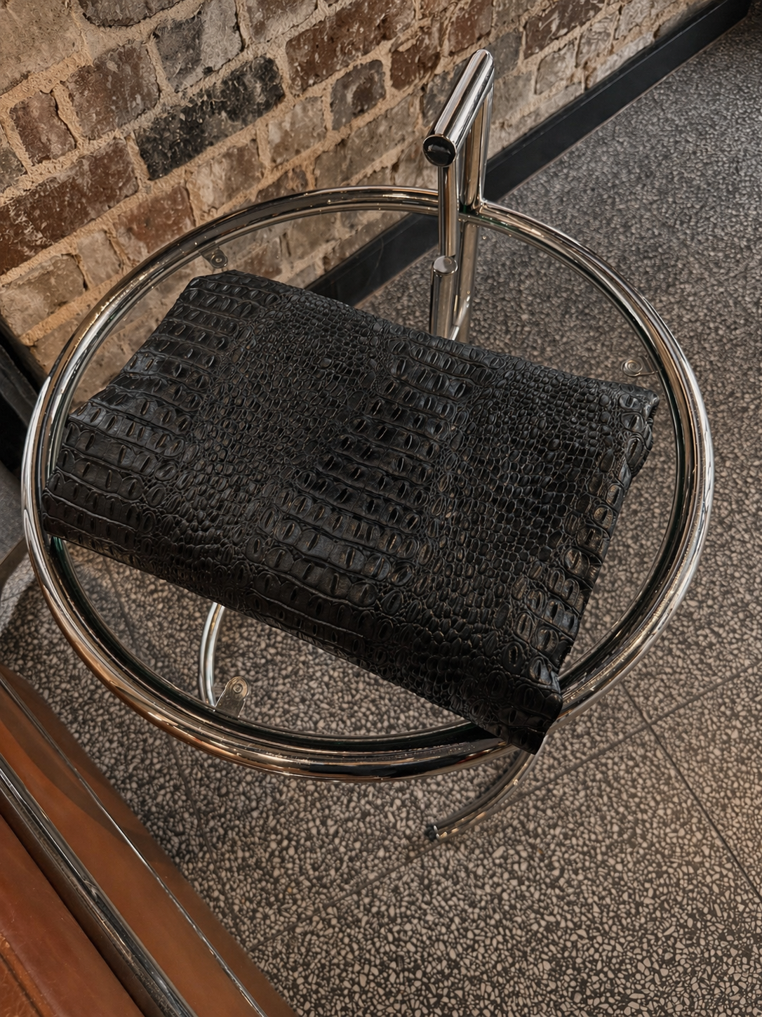 SOLENNE Laptop sleeve in vegan crocodile leather on table